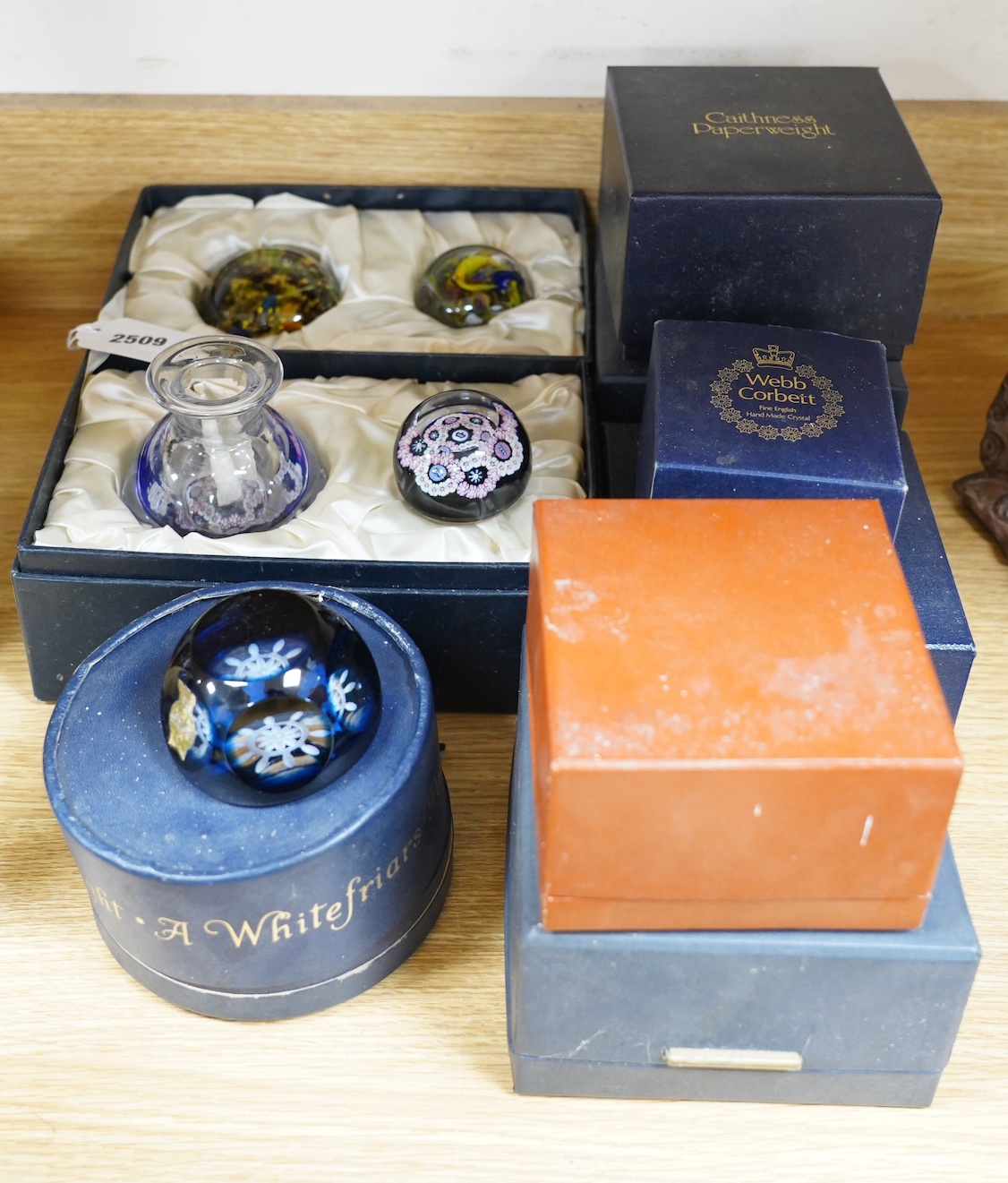 A collection of boxed Whitefriars and Caithness paperweights and others (10)